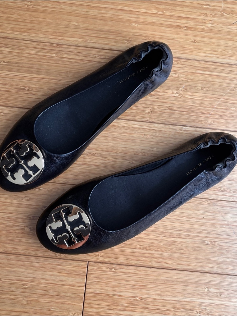 Tory Burch reva black leather ballet flats with gold tone detail